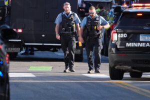 2 Killed and 2 Officers Shot at Minneapolis Apartment Building